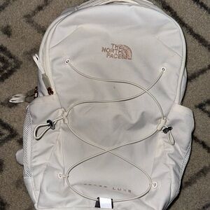 The North Face Cream Backpack with Bungee Cords
